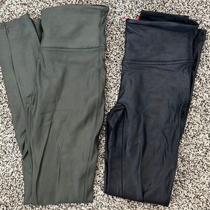Two pairs of SPANX leggings - faux leather black and olive green. Size small.